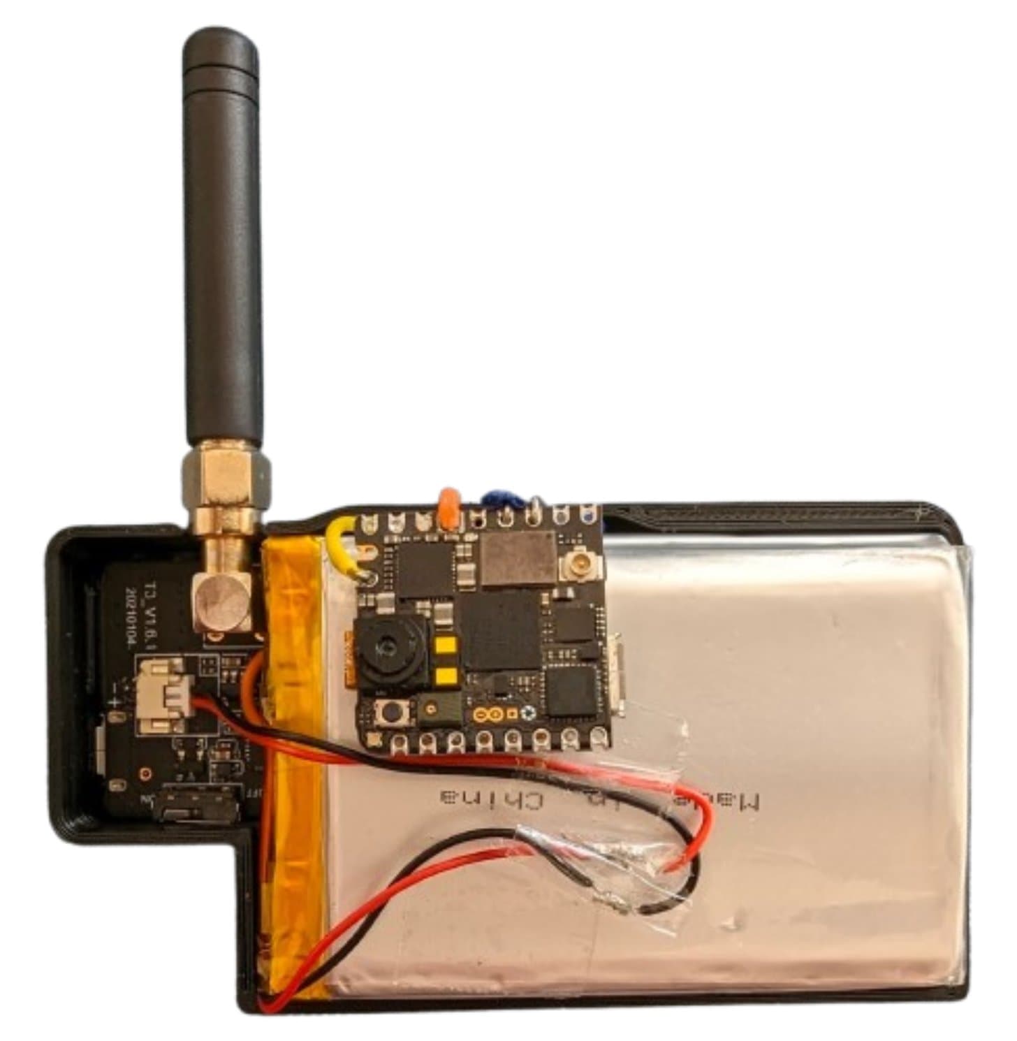 The Dataset Collector opened: the Nicla Vision camera board on top of the battery, the LoRa board and antenna to the left