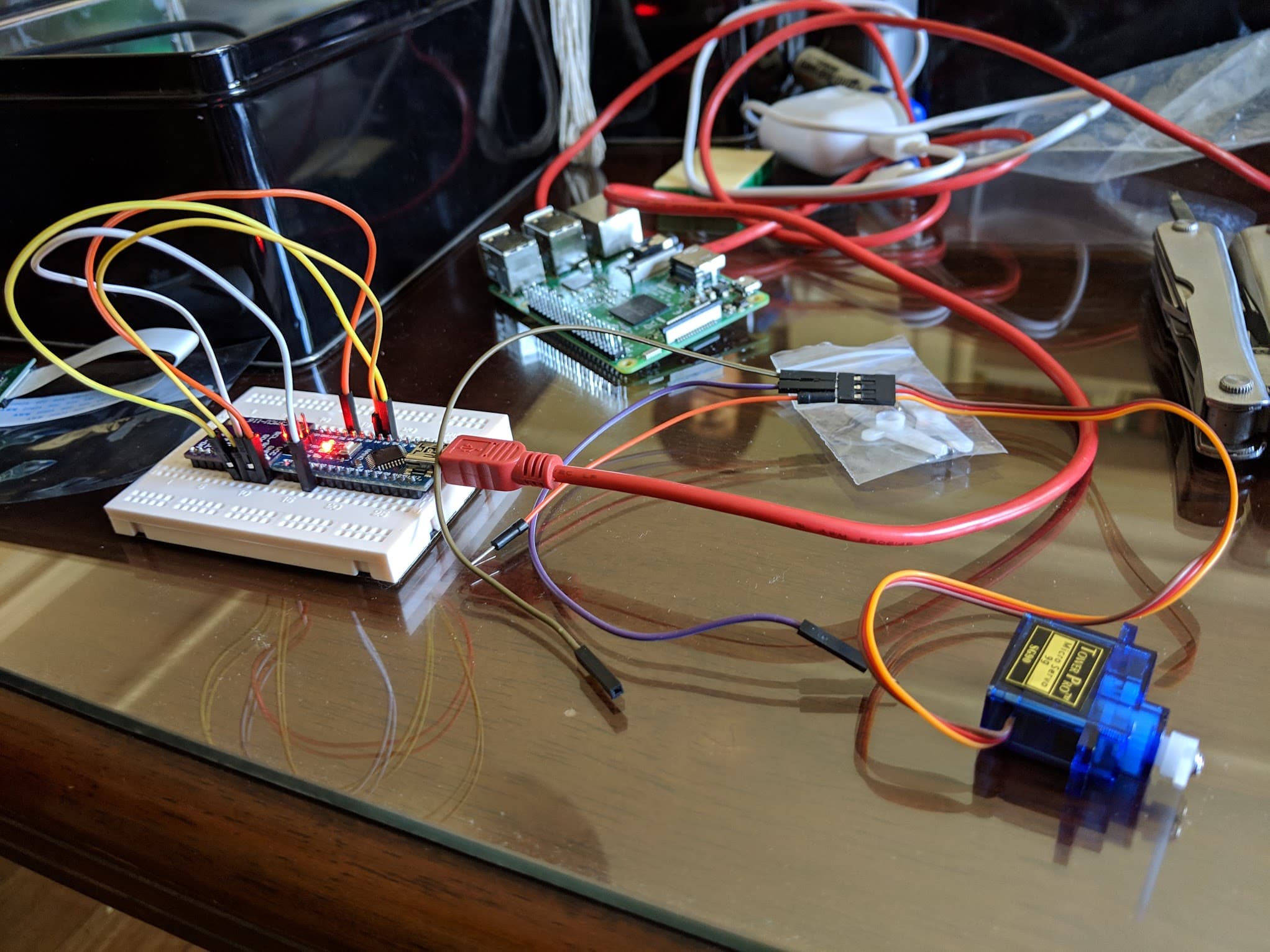 The parachute release mechanism: a servo wired to the Pi and breadboard