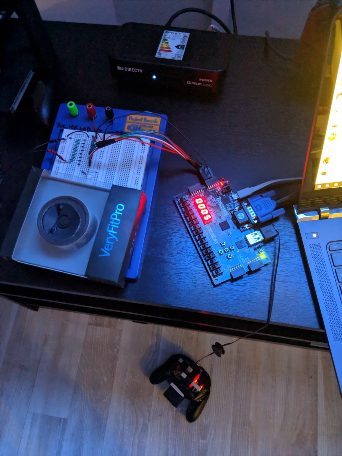 The finished setup: Basys 3, the breadboard VGA stage, and the monitor running the game