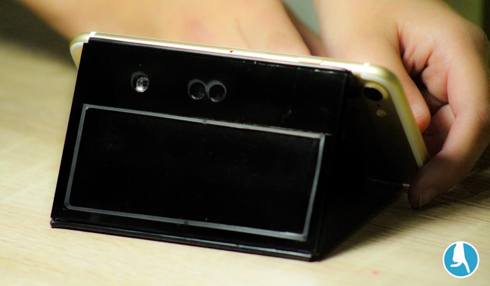 The prototype: camera and phone mount that ran the vision and speech pipeline