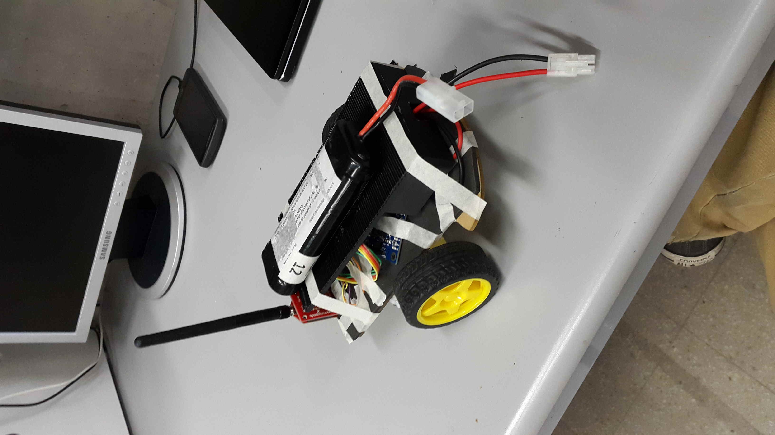 The robot: motor chassis, battery pack, and antenna for remote debugging